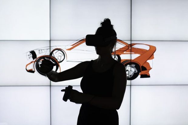 Image shows a women with vr equipment