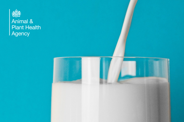 Milk being poured into a glass. The APHA logo is also displayed.