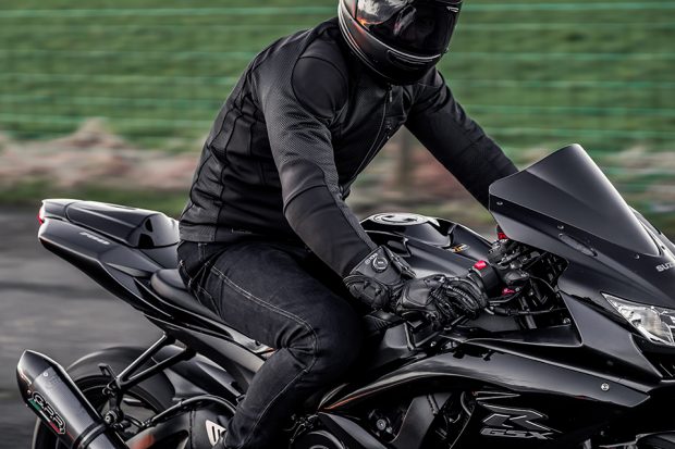 Man riding a bike wearing Planet Knox Clothing