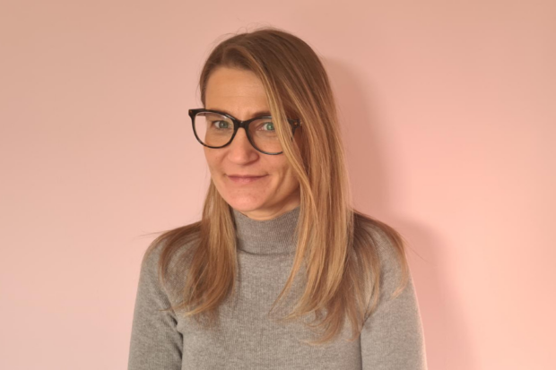 Image of charlene pink (female) looking at camera with pink background