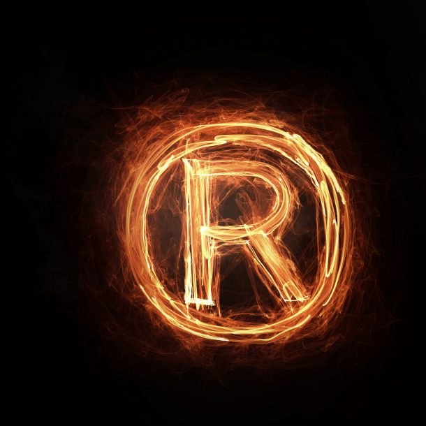 Glowing fire copyright sign on dark background