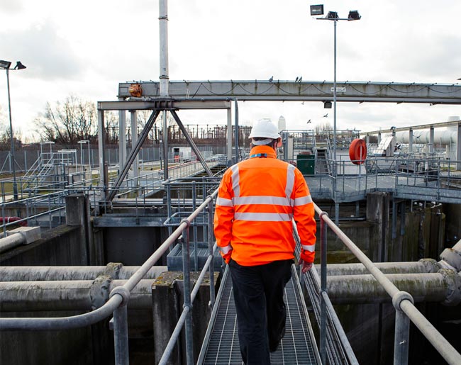 A person in a water treatment works