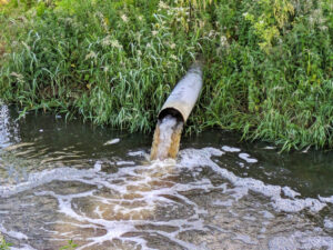 Stock photo of an outflow pipe discharging waste into river in the UK, uploaded to iStock in 2024 Stock photo of an outflow pipe discharging waste into river in the UK, uploaded in 2024