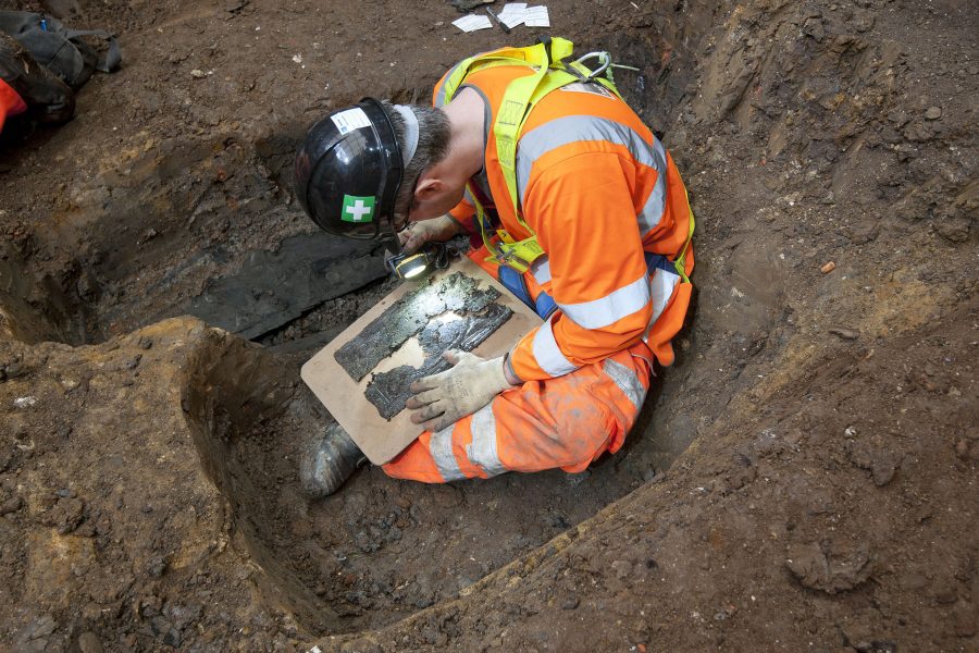 An archaeologist examines a coffin plate at St James’s.
