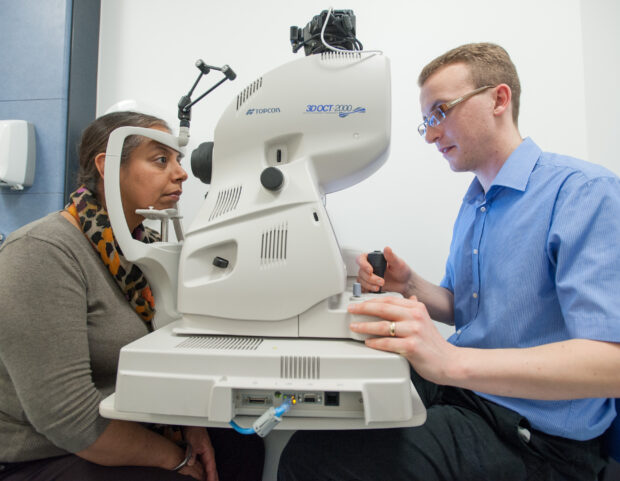 A photo of a lady having an eye screening