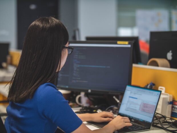 Woman at laptop in office setting