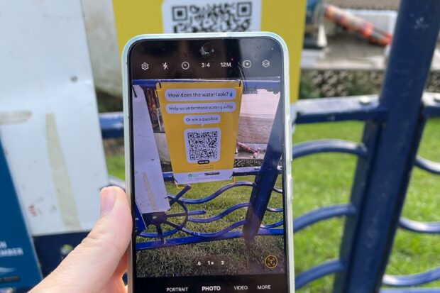 A smart phone being pointed at a QR code