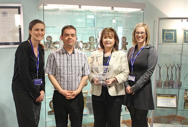 The Allstate NI team holding their 2005 Queen's Award