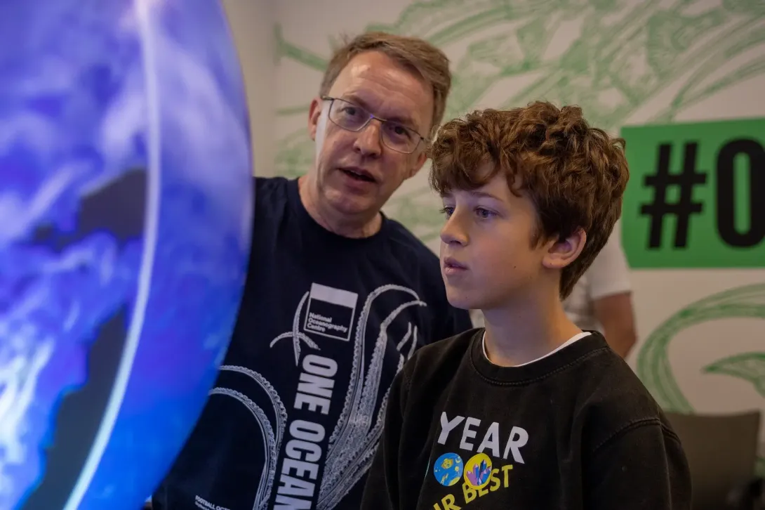 Ocean expert explaining a model at open day
