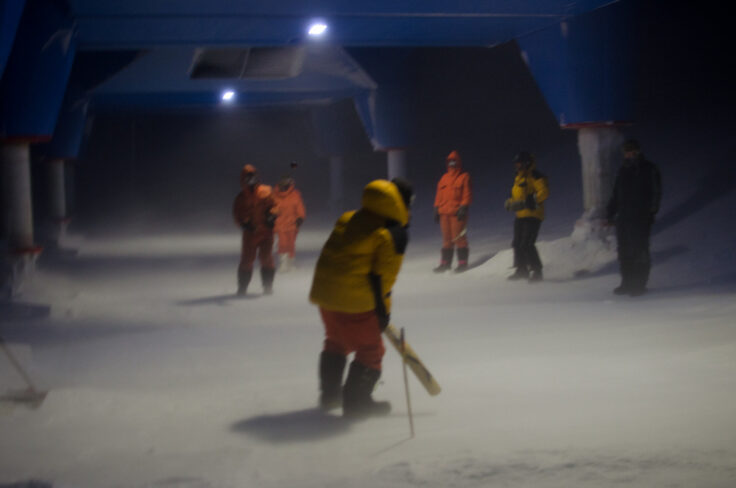 A group of people walking in the snow