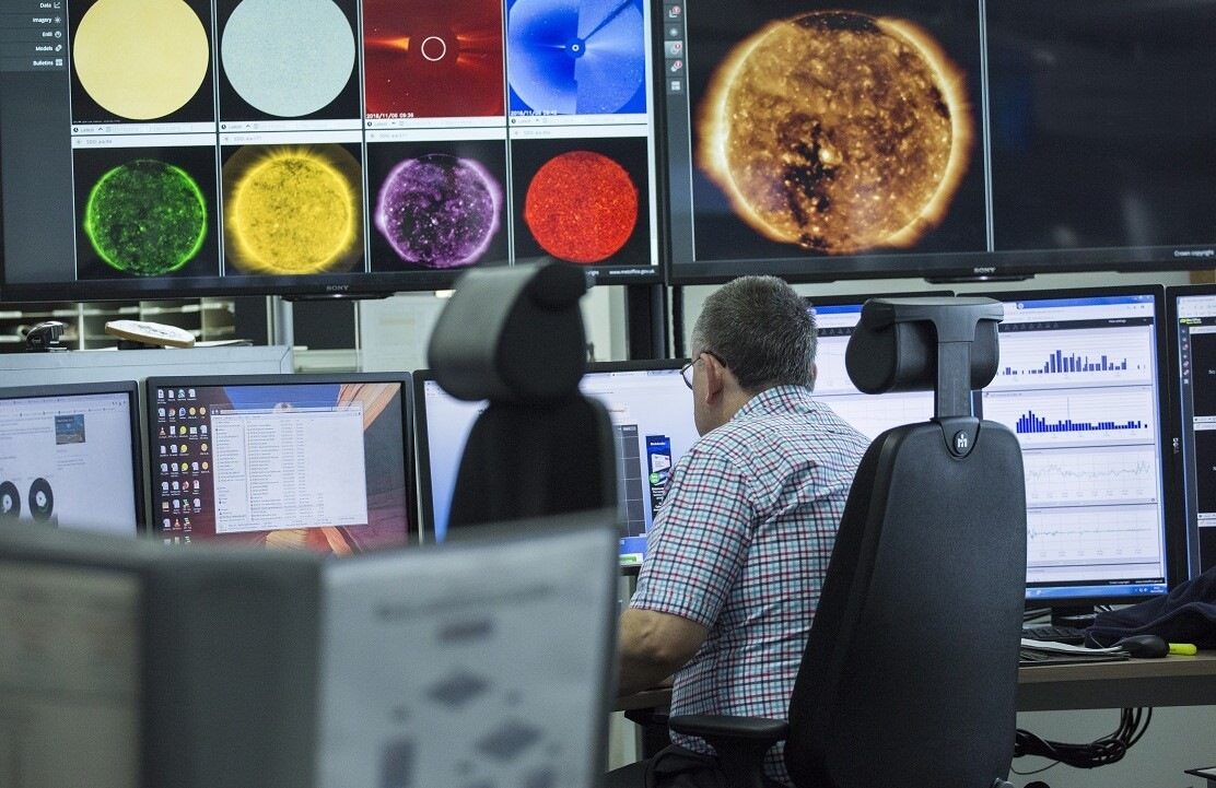 Space weather multiple screens man.jpg