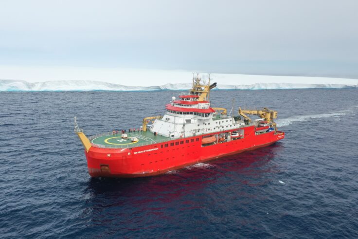 The research ship, RRS Sir David Attenborough (SDA), moving through the Weddell Sea alongside the giant iceberg A23a in December 2023.