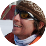 A man wearing a hat and sunglasses