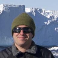 A man in fron of a mountain