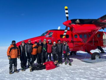 A group of people that are standing in the snow