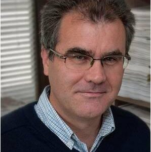 A man wearing glasses and looking at the camera.