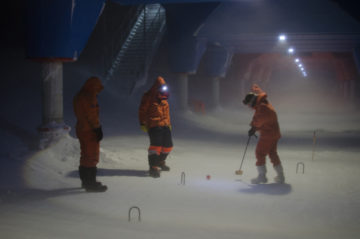 A group of people skiing on the snow.