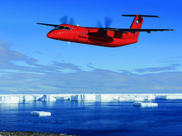A plane flying over a body of water