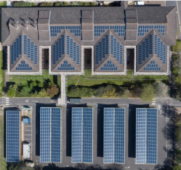 Aerial photo of a range of buildings with solar PV