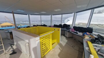 Inside an octagonal communications tower with views across a snowy landscape