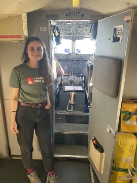 A smiling woman on a plane