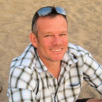 A man sitting on a table.