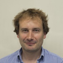 A man smiling for the camera.