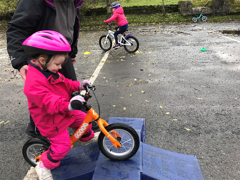 Child on balance bike
