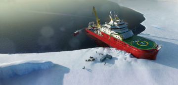 A boat by the side of snow covered land