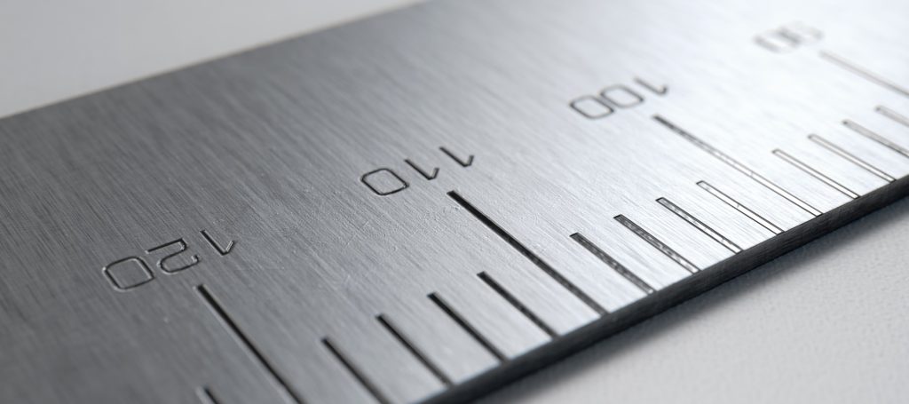 Close-up photo of a metal ruler.