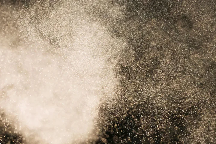Dust particles spreading through the air