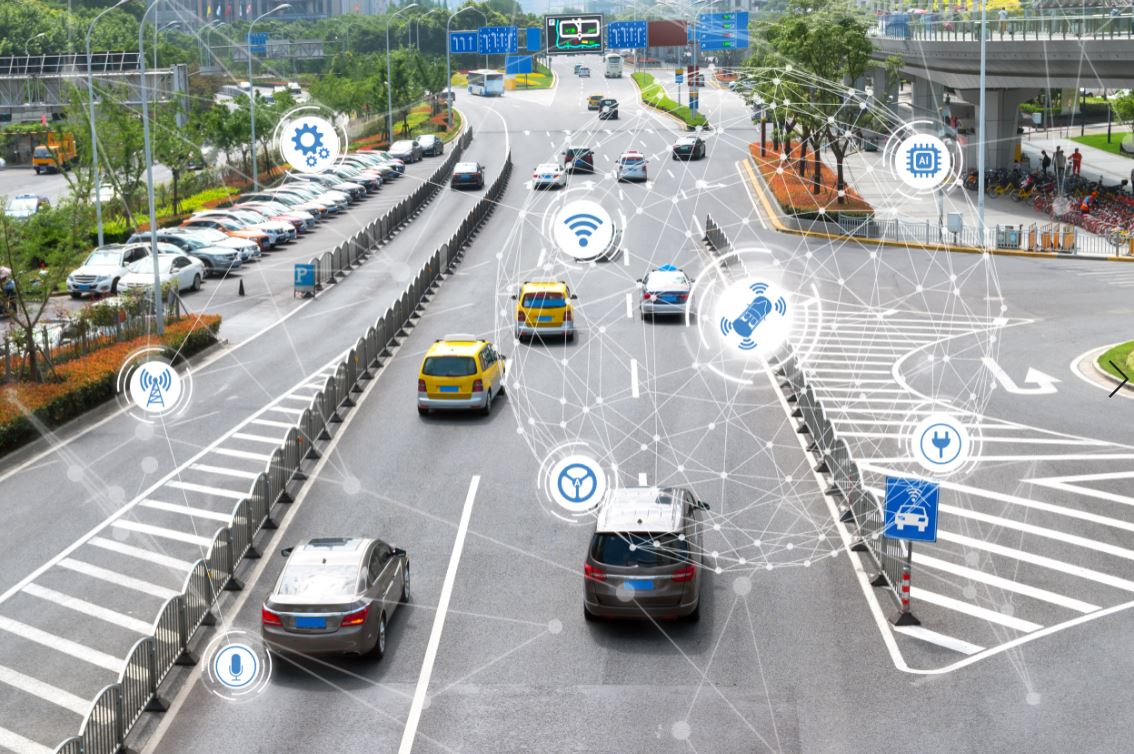 Smart city concept with cars on a road, overlaid with technology icons like Wi-Fi, GPS, and wireless communication.