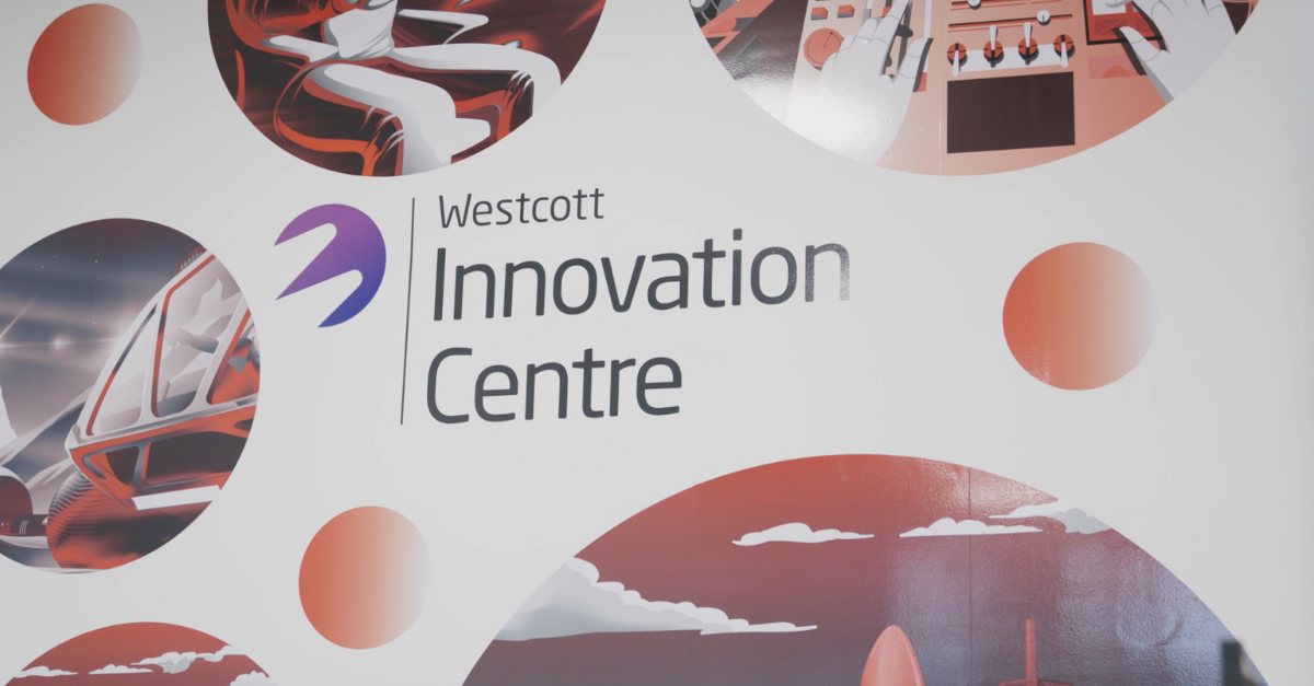 Westcott Innovation Centre sign with futuristic and technology-themed design elements in red and white.