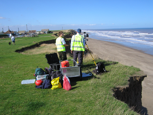 BGS staff scanning the cliff from above.