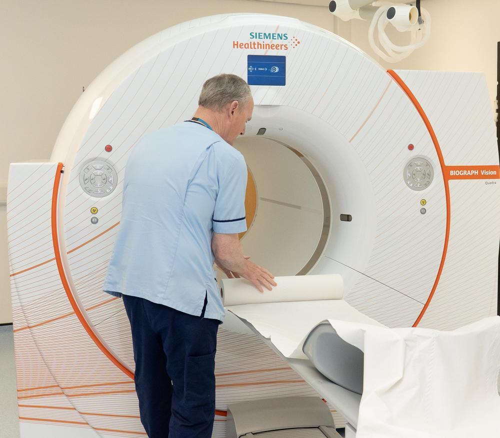Doctor using a total-body PET scanner
