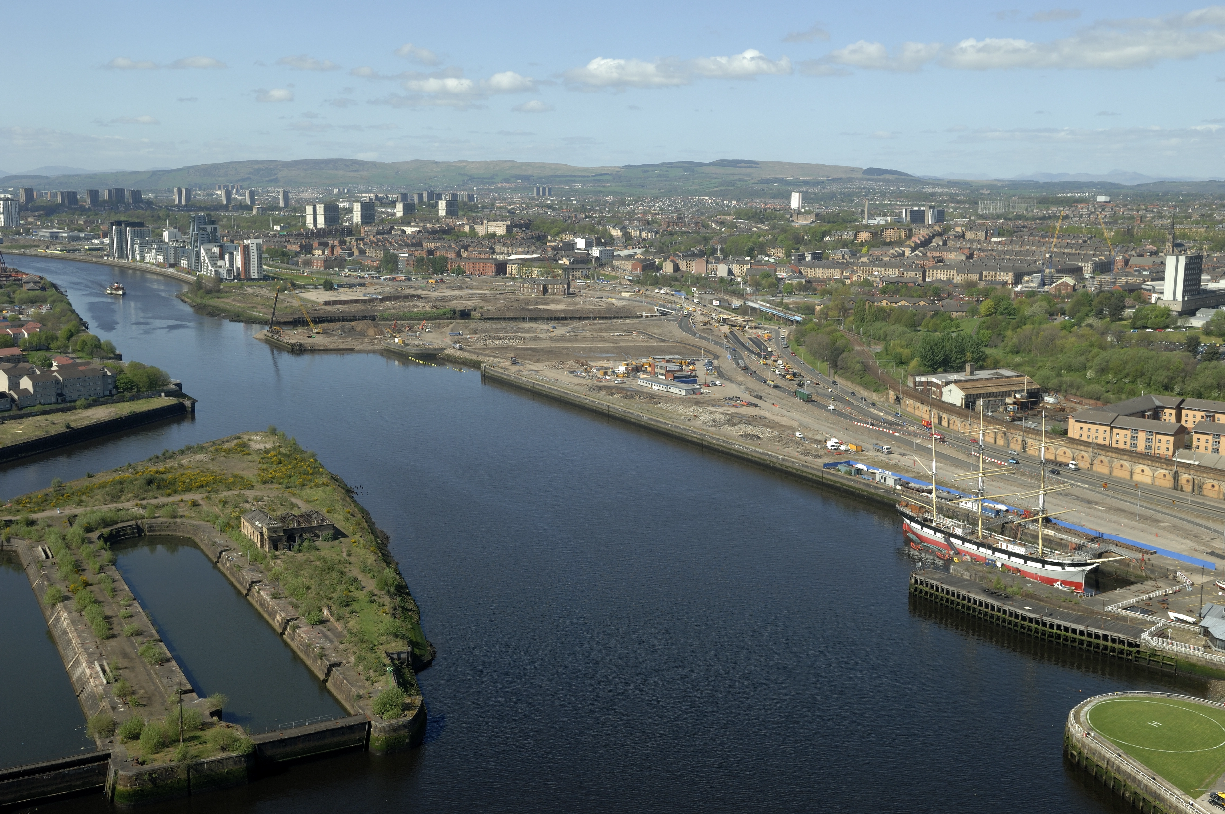 A river running through an industrial landscape