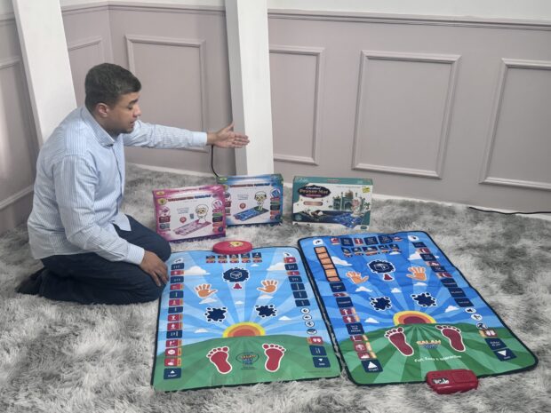 Kamal Ali, founder of My Salah Mat, showing his product the world’s first interactive prayer mat for children.