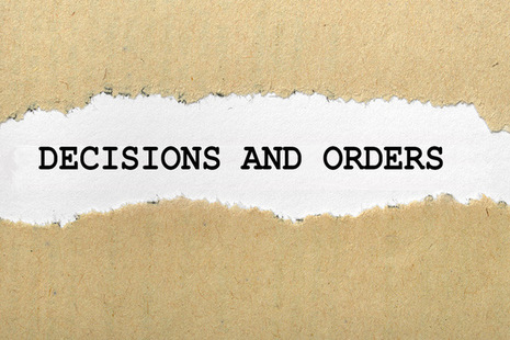 decisions and order text within ripped paper - licensed from Ingram image