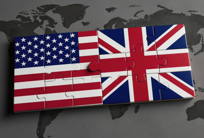 A jigsaw puzzle of the Union Jack and the US flag over a world map.