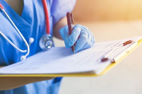 Doctors writing notes
