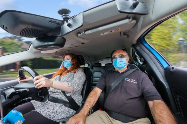 ADI driving instructor with pupil