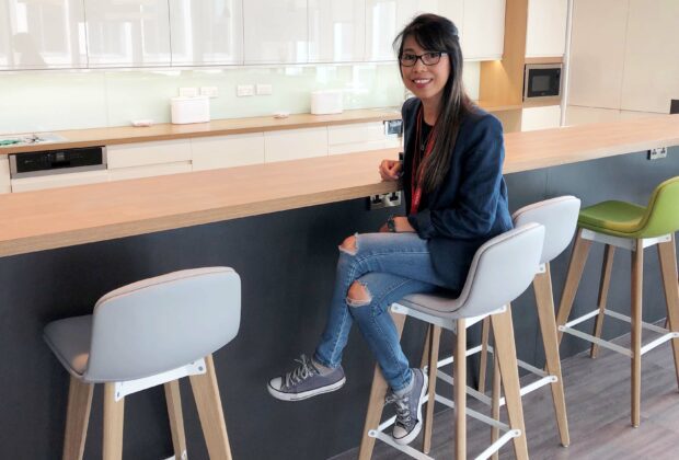 Rowena sat on a high chair at a worksurface