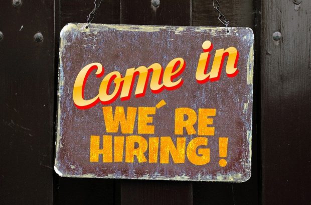 A plaque with the words 'Come in we're hiring'