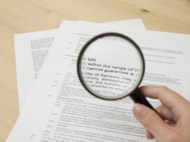 Magnifying glass used to look in detail at papers