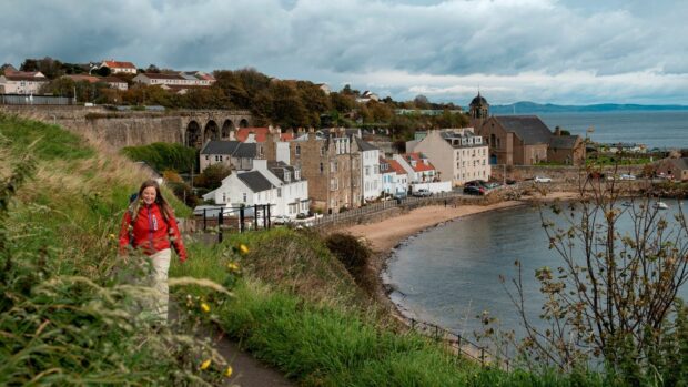Woman walking a coastal path