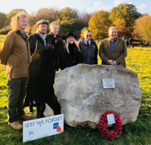 Councillors standing behind a First World War memorial stone at Aston Rowant National Nature Reserve