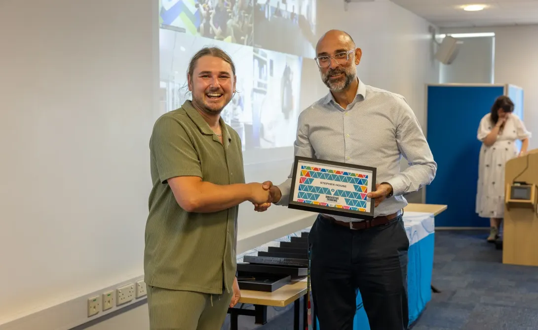 Stephen House receiving a values award
