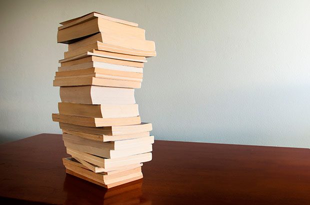 Stack of books on a desktop.