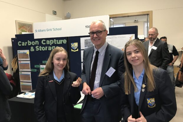 Government Chief Scientific Adviser Sir Patrick Vallance posing with schoolchildren at the Industrial Strategy Science Fair.