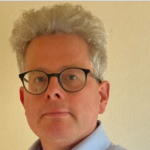 Headshot of Tom Clark, member of the Social Security Advisory Committee